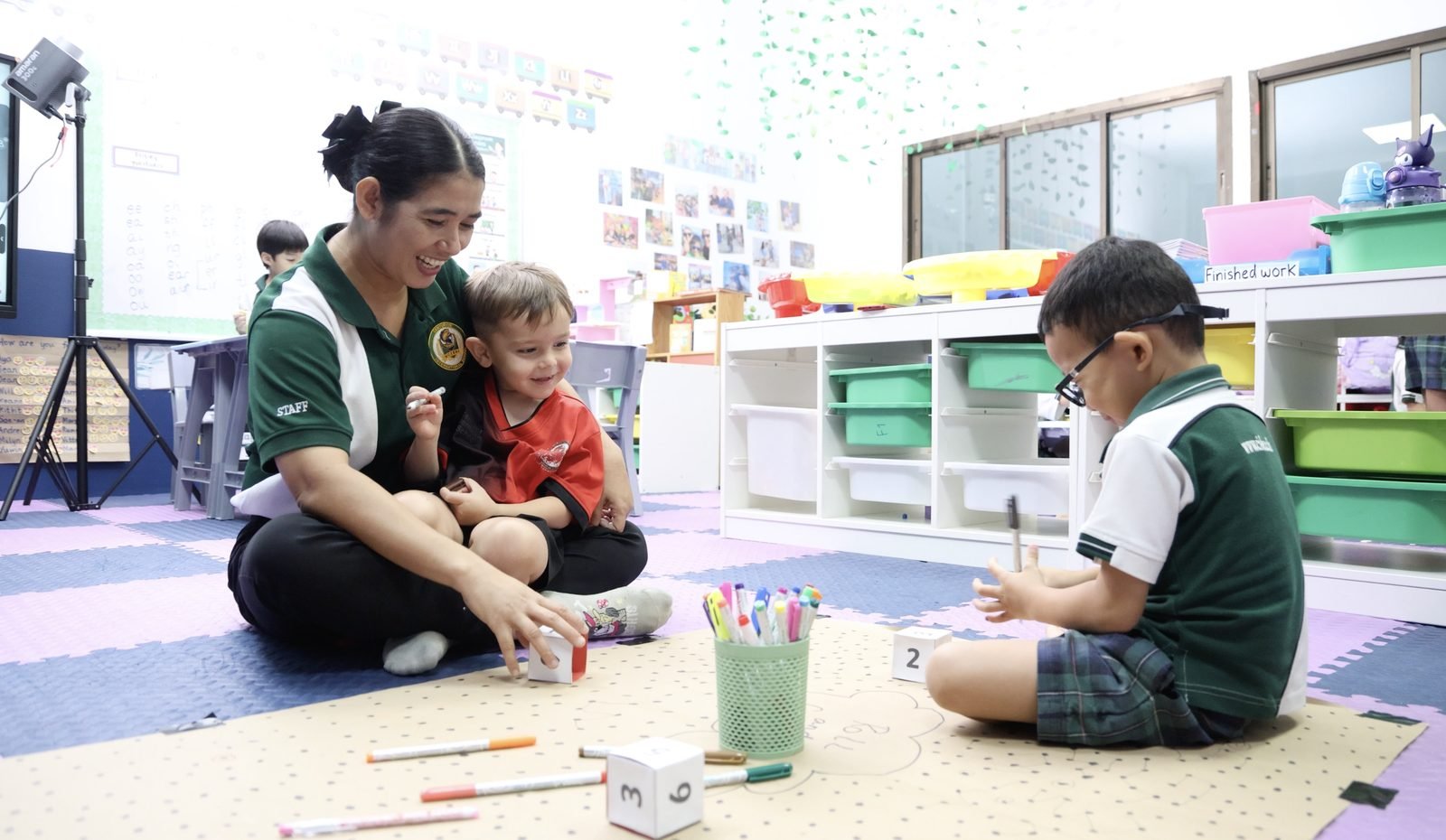 Early Years teacher bonding with a student at CISB - 2